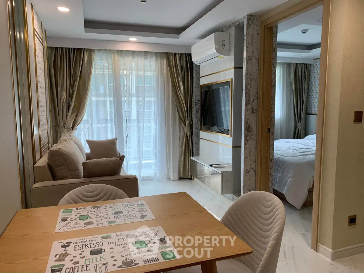 Modern open-plan living and dining area with elegant decor and natural light.