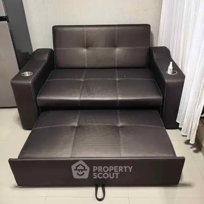 Modern leather sofa bed in a stylish living room setting with sleek design and multifunctional use.