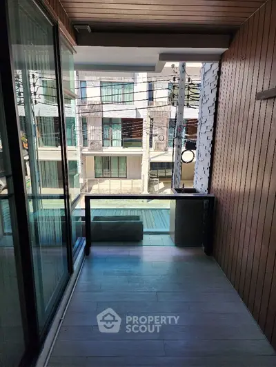 Modern living room with stylish decor and large windows