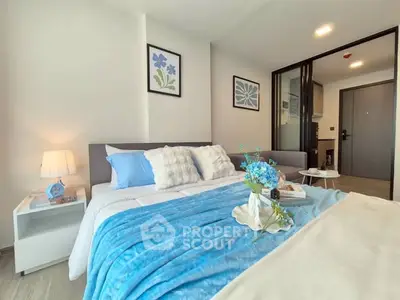 Modern bedroom with stylish decor and cozy blue accents