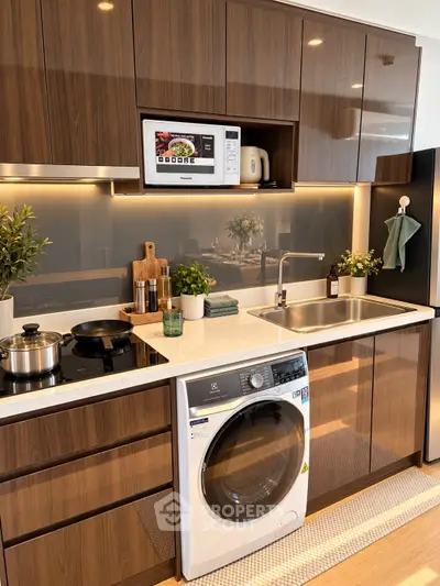 Modern kitchen with sleek wooden cabinets, built-in microwave, and washing machine, perfect for urban living.
