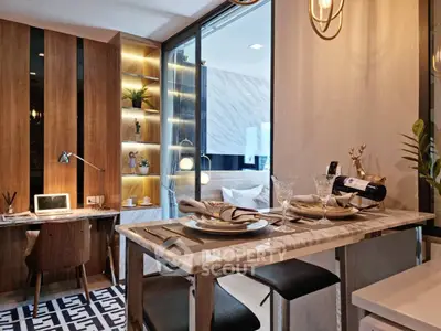 Modern open-layout kitchen with elegant dining setup and cozy study nook