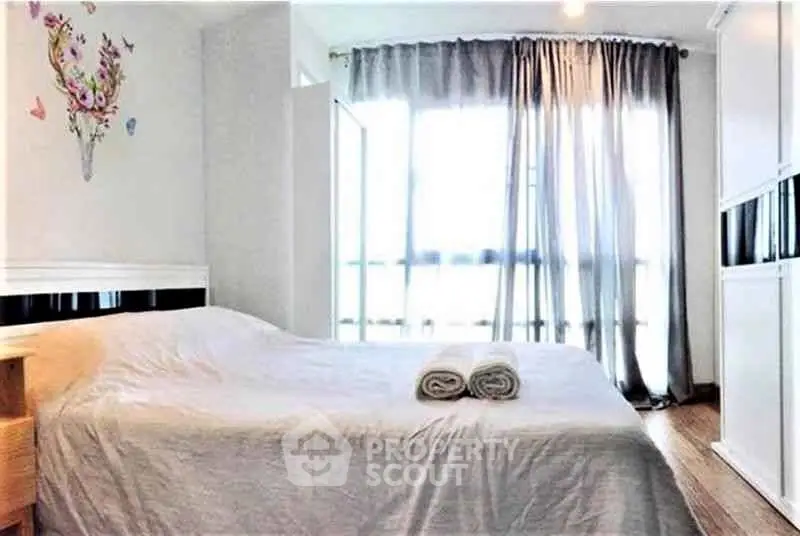 Bright and airy bedroom with large windows and modern decor