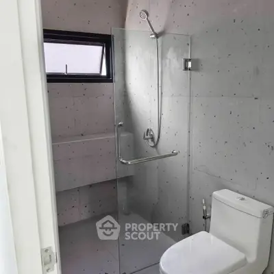 Modern bathroom with sleek glass shower and minimalist design