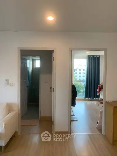 Modern apartment interior with bright living space and wooden flooring