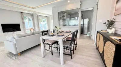 Modern open-plan living and dining area with stylish decor and natural light.