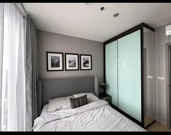 Modern bedroom with sleek design and ample natural light