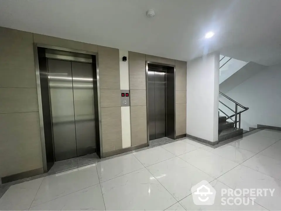 Modern building elevator lobby with sleek design and polished floors