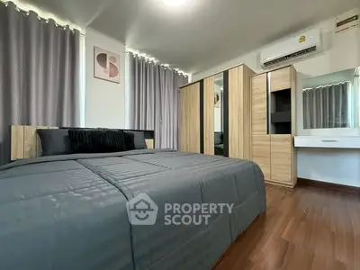 Modern bedroom with stylish decor and ample storage space