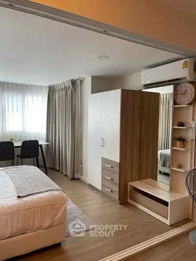 Modern bedroom with stylish furniture and natural light