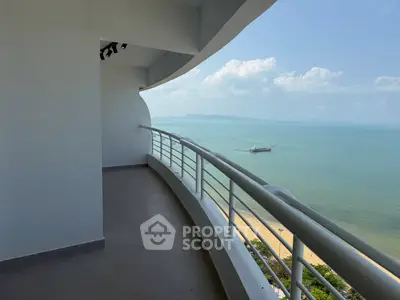 Stunning beachfront balcony with panoramic ocean views, perfect for relaxation and enjoying the sea breeze.