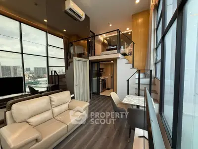 Modern loft apartment with mezzanine, large windows, and stylish interior design.