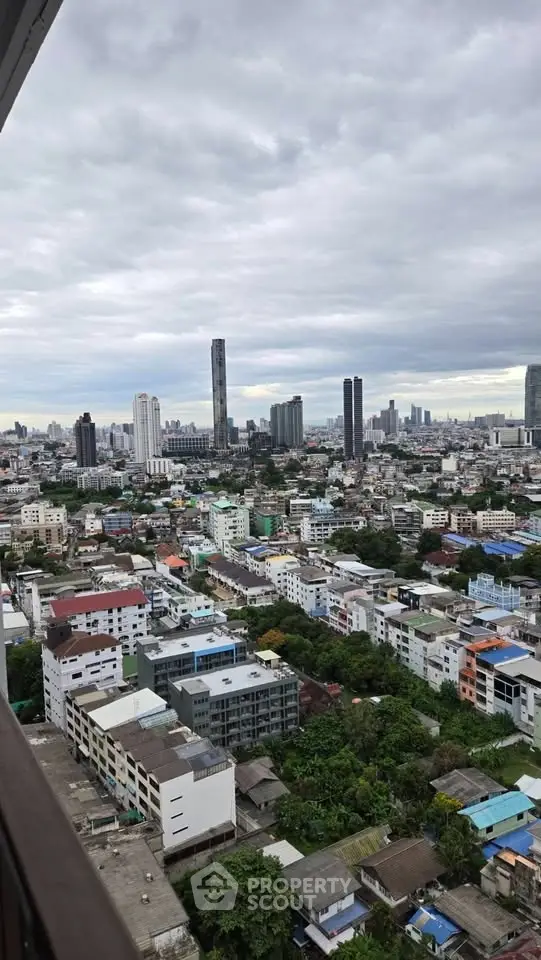 Stunning cityscape view from high-rise building showcasing urban skyline and vibrant neighborhood.