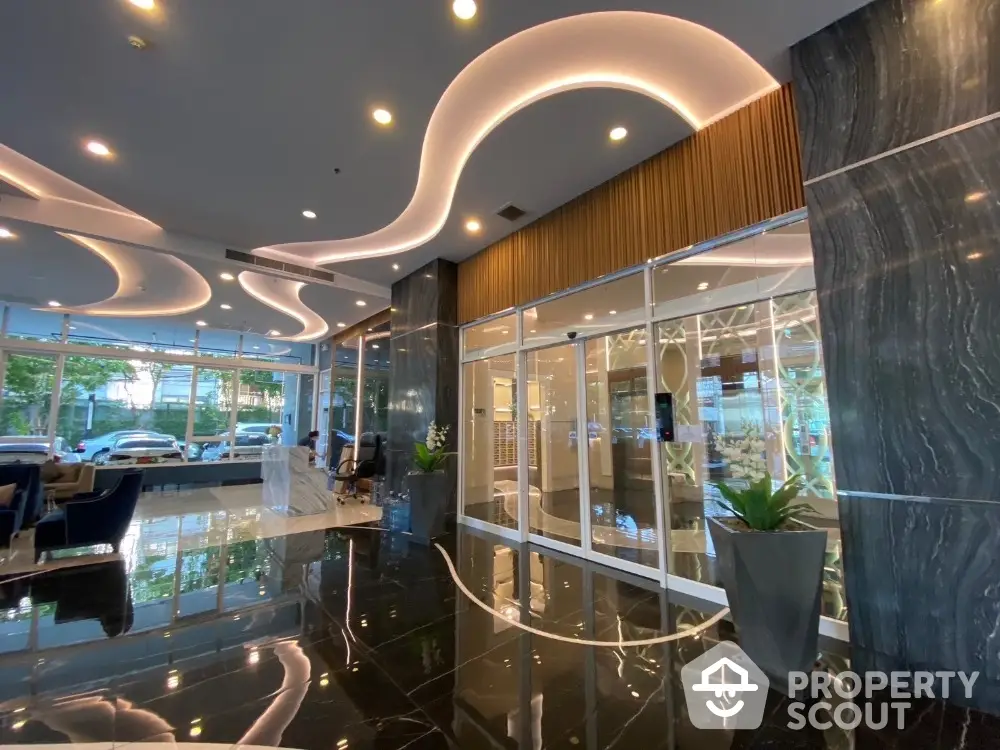 Luxurious modern building entrance with sleek design and elegant lighting