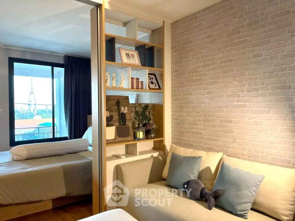 Modern apartment with cozy living room and stylish bedroom, featuring elegant decor and natural light.
