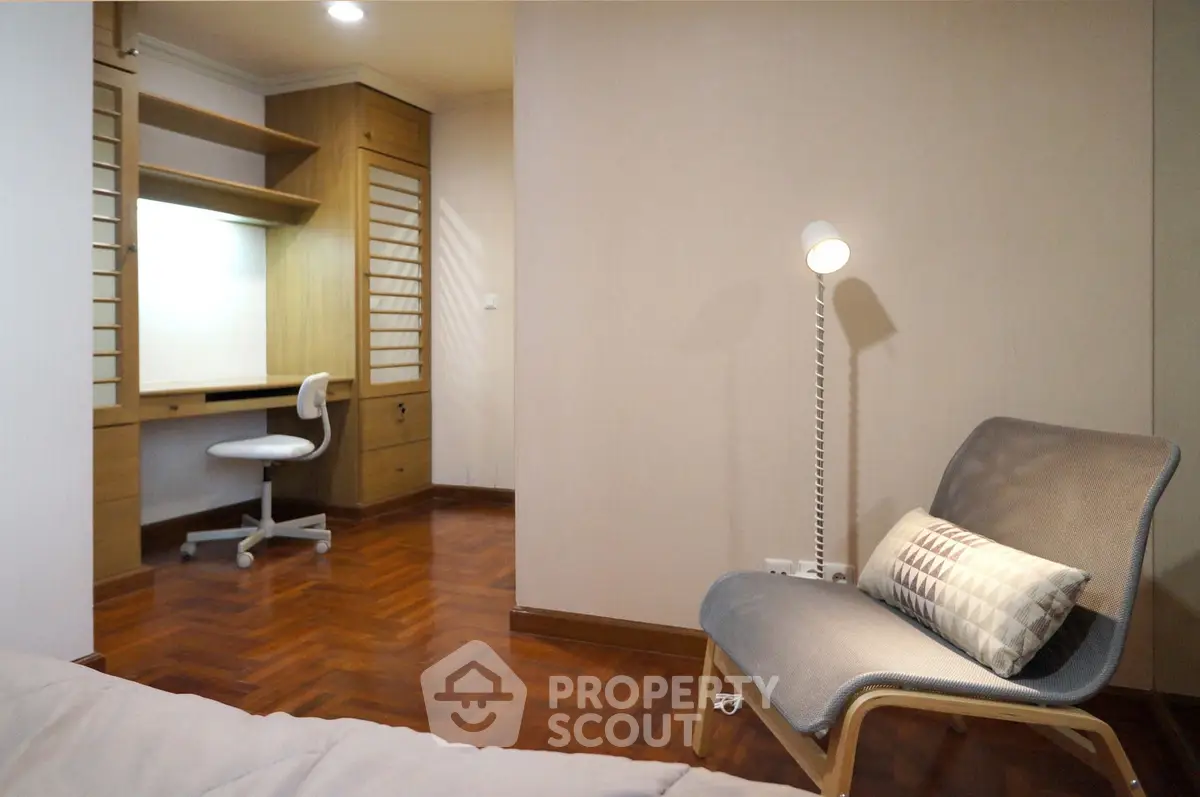 Cozy study room with modern chair and built-in desk, perfect for productivity.