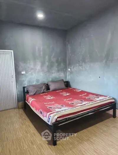 Spacious bedroom with modern design and comfortable bed in a stylish home.