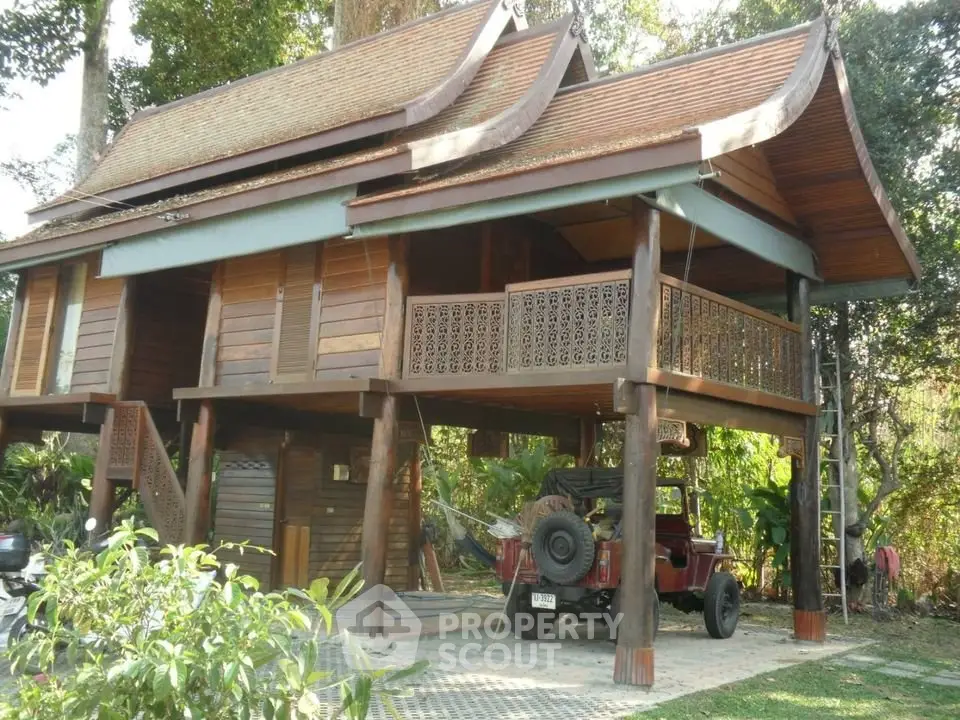 Charming traditional wooden house with elevated design and lush surroundings.