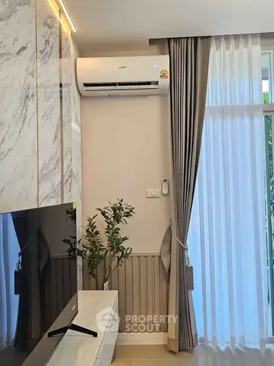 Modern living room with air conditioning and elegant decor