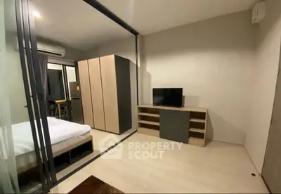 Modern bedroom with glass partition and sleek furniture design