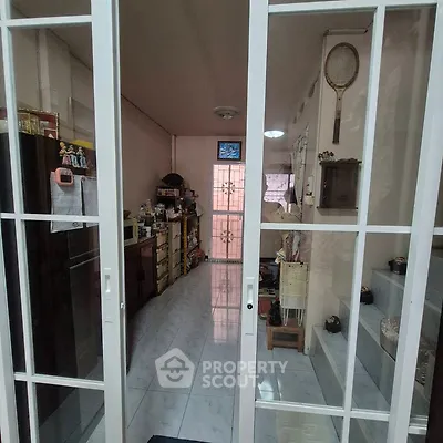Cozy interior space with sliding glass doors and decorative elements.