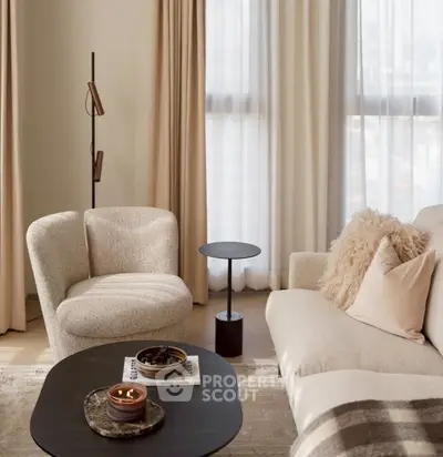 Elegant living room with plush seating and modern decor, featuring soft lighting and neutral tones.