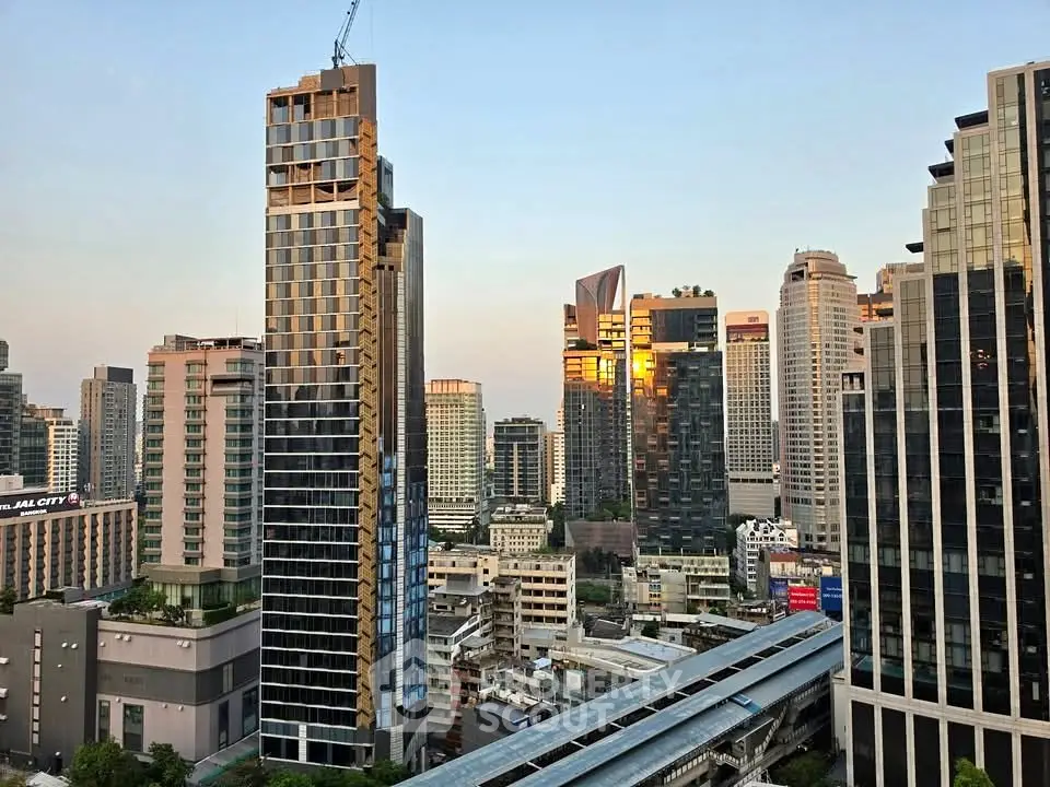Stunning cityscape view of modern high-rise buildings at sunset, showcasing urban living at its finest.