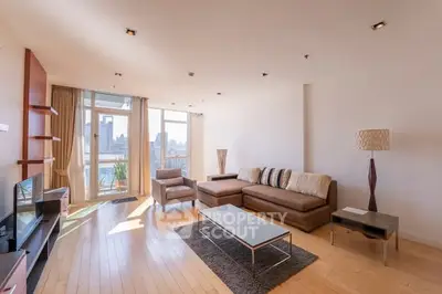 Spacious modern living room with city view and elegant furniture