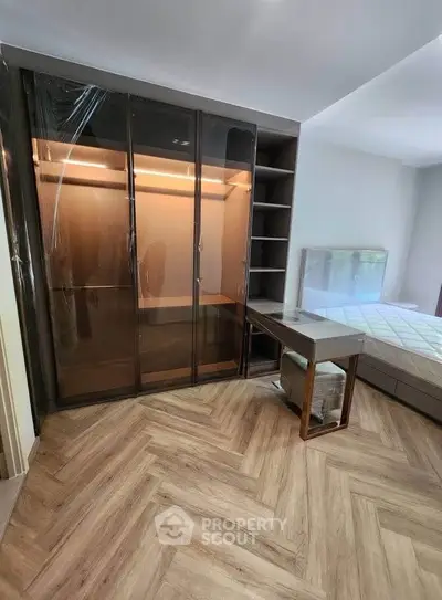Modern bedroom with sleek wardrobe and stylish flooring