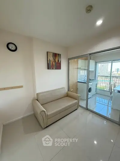 Modern apartment with sleek living area and kitchen view