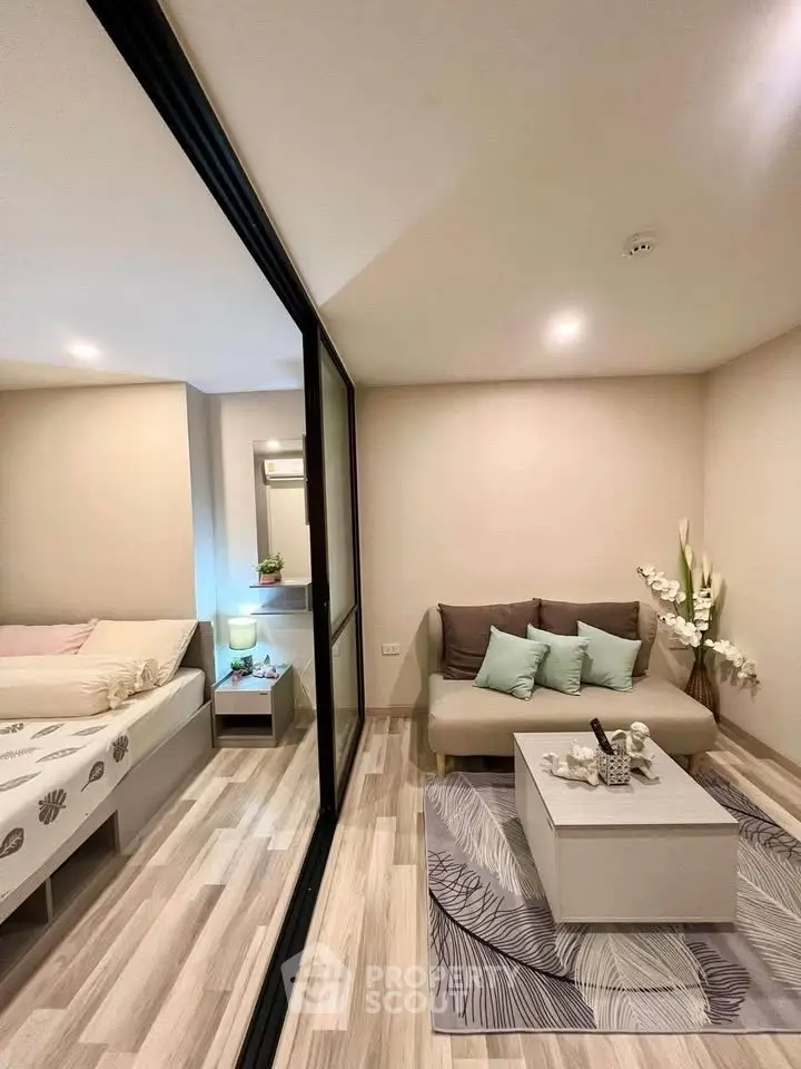 Modern living room with cozy sofa and stylish decor in a contemporary apartment.