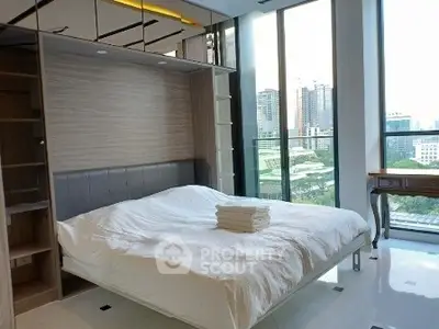 Luxurious bedroom with stunning city view and modern furnishings