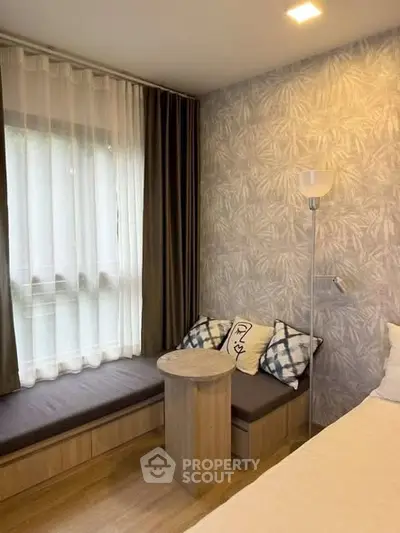 Cozy bedroom with stylish decor and natural light