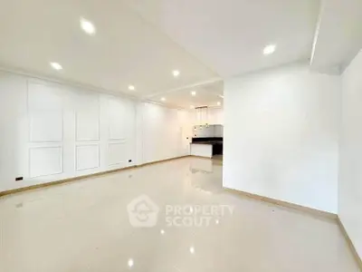 Spacious modern living room with open layout and elegant lighting