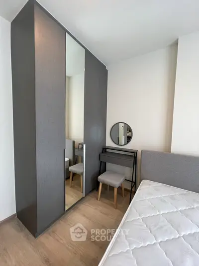 Modern bedroom with sleek wardrobe and stylish vanity set