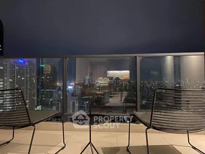 Stunning cityscape view from a modern balcony with sleek seating, perfect for urban living.