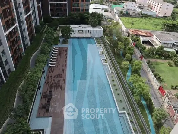 Luxurious apartment complex with stunning pool and lush greenery, perfect for relaxation and leisure.