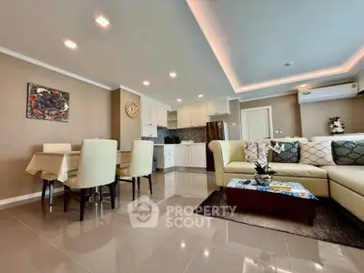 Spacious modern living room with open kitchen and elegant dining area