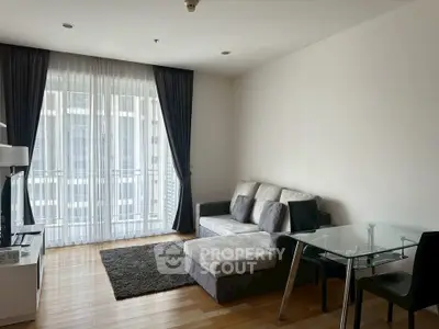 Modern living room with stylish furniture and large window for natural light.