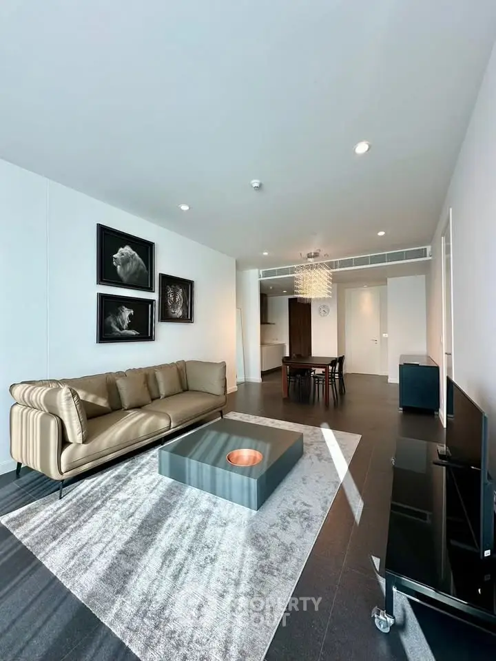 Modern living room with stylish decor and ample natural light in a contemporary apartment.
