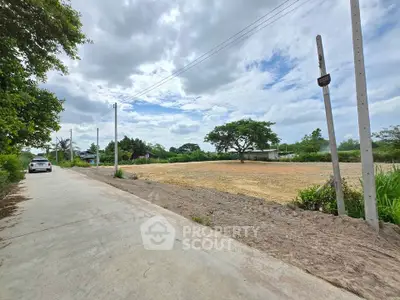 Expansive vacant land with lush greenery, perfect for development opportunities.