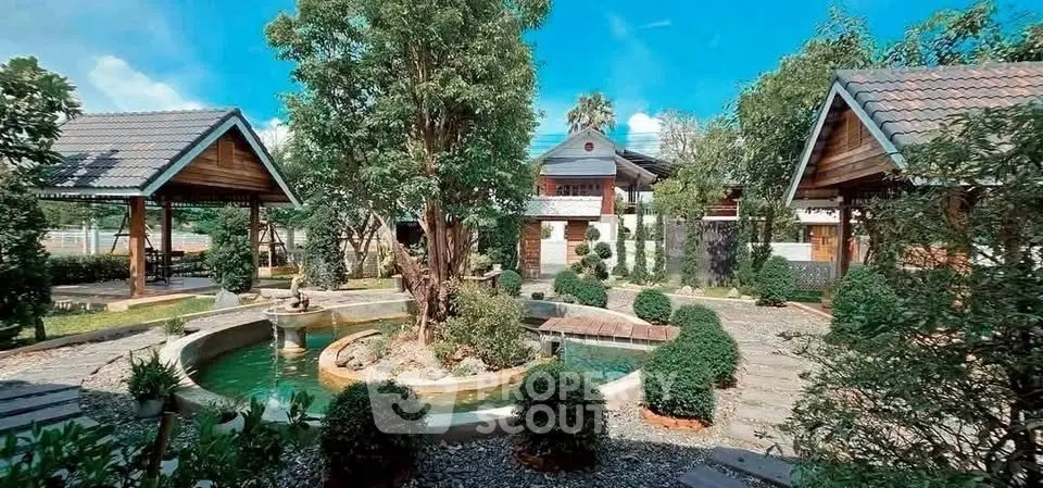 Charming garden view with traditional-style pavilions and lush greenery, perfect for serene living.