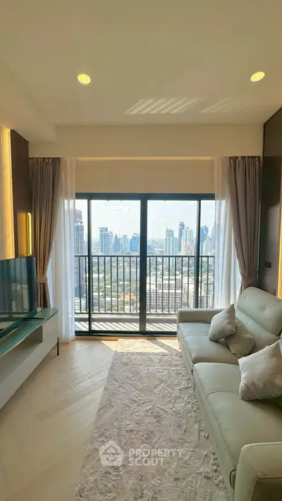 Luxurious living room with stunning city view from high-rise balcony.