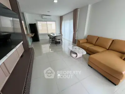 Spacious modern living room with sleek furniture and open layout