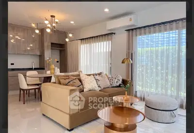 Modern living room with stylish decor and open kitchen layout