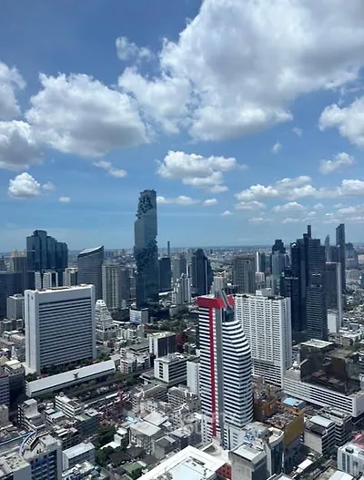 Stunning cityscape view showcasing modern skyscrapers under a vibrant blue sky.