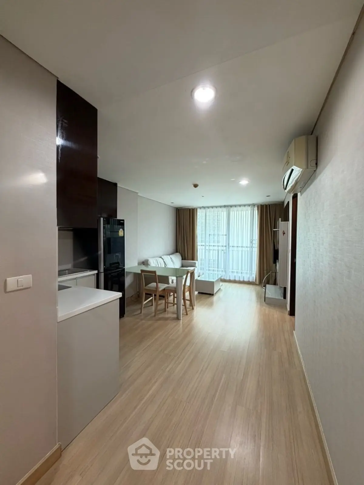 Modern living room with wooden flooring and natural light