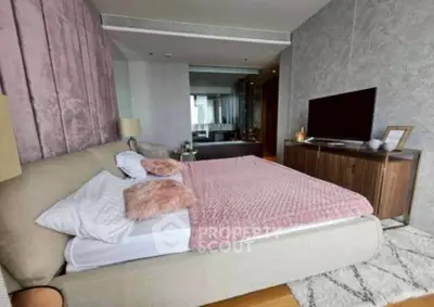 Luxurious bedroom with plush bedding and modern decor in upscale apartment