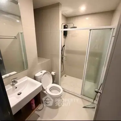 Modern bathroom with glass shower and sleek fixtures