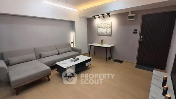 Modern living room with stylish furniture and elegant lighting